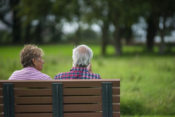 Older couple sitting on a bench