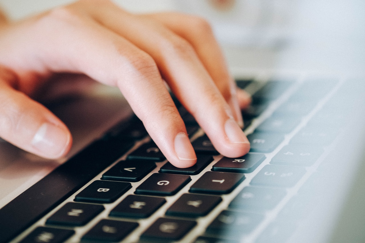 Person typing on laptop