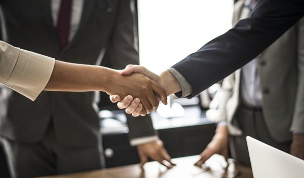 Two people shaking hands
