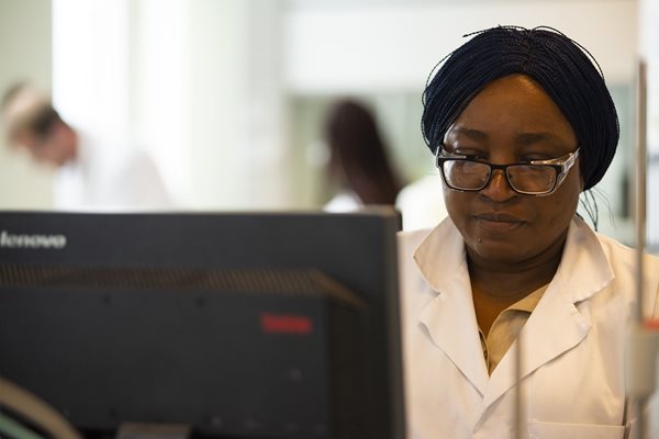 Woman using computer in lab